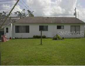 1661 Alton Road Port Charlotte, FL 33952 - Photo 1 of 1 a house view with a garden space