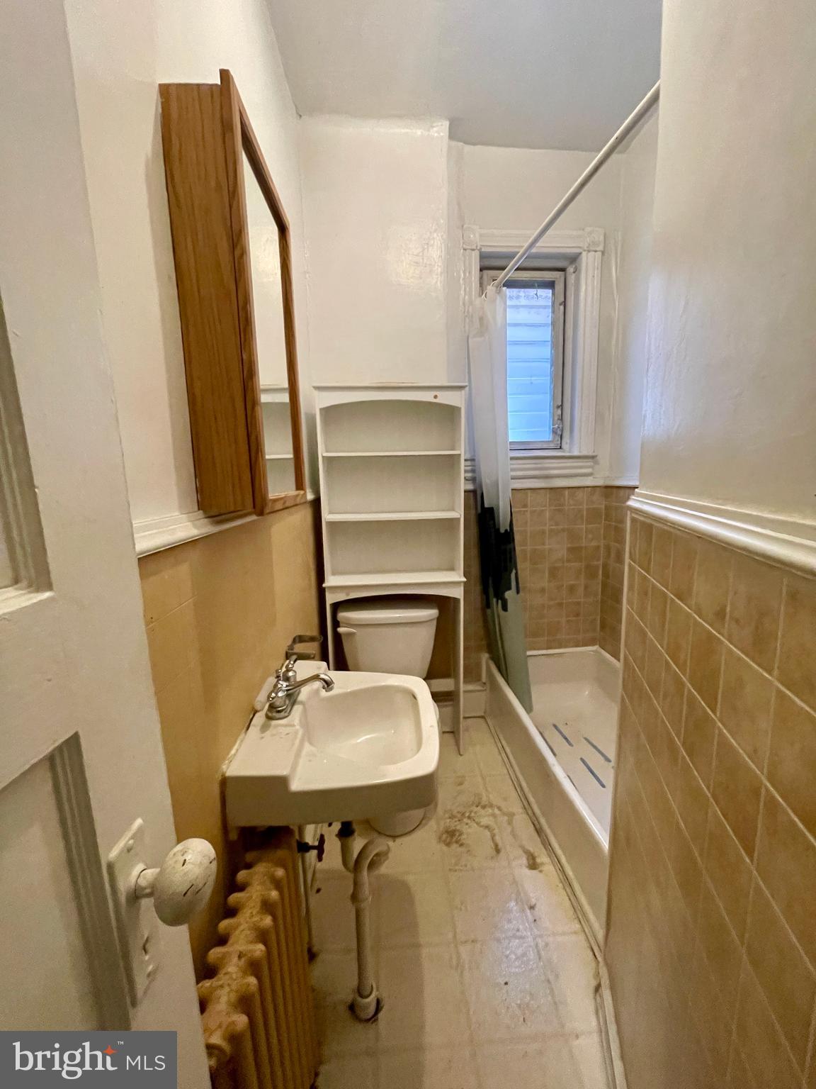 208 North 63rd Street Philadelphia, PA 19139 - Photo 11 of 29 a bathroom with a sink and a mirror