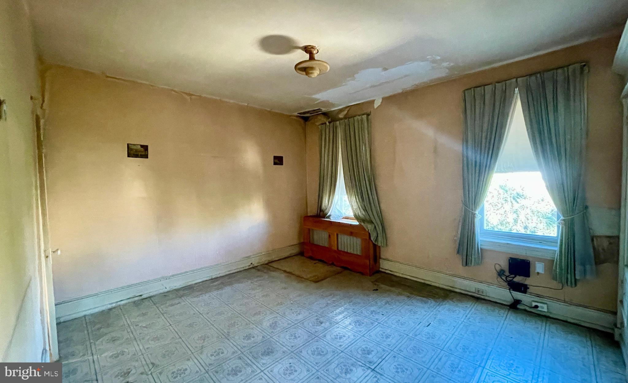 208 North 63rd Street Philadelphia, PA 19139 - Photo 24 of 29 an empty room with a window and a ceiling fan