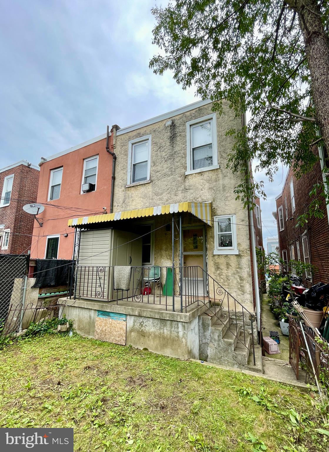 208 North 63rd Street Philadelphia, PA 19139 - Photo 26 of 29 a front view of a house with garden