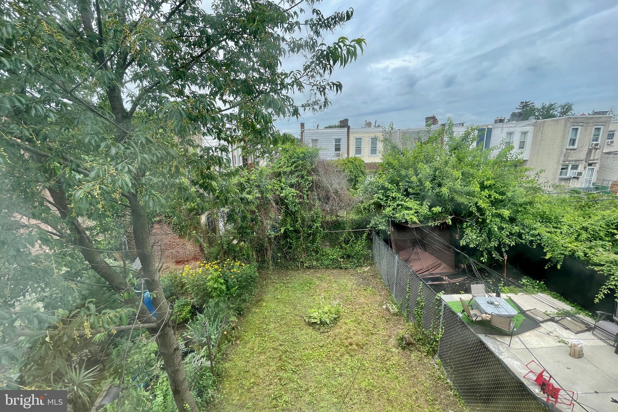 208 North 63rd Street Philadelphia, PA 19139 - Photo 27 of 29 a backyard of a house with lots of green space