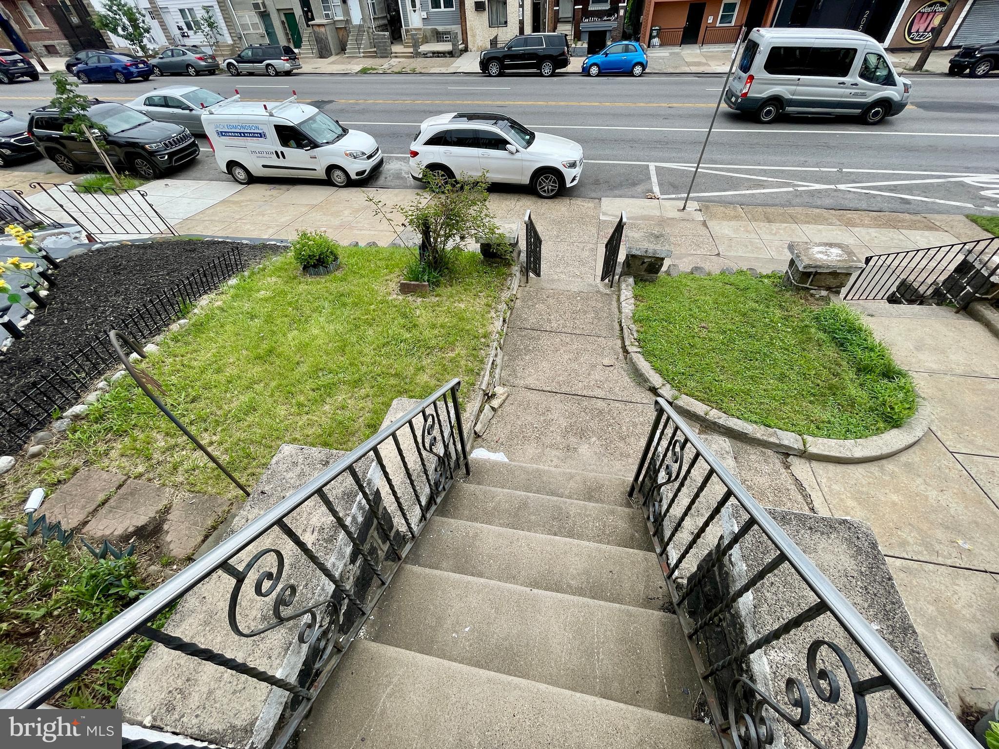 208 North 63rd Street Philadelphia, PA 19139 - Photo 4 of 29 a view of a backyard with lawn chairs and plants