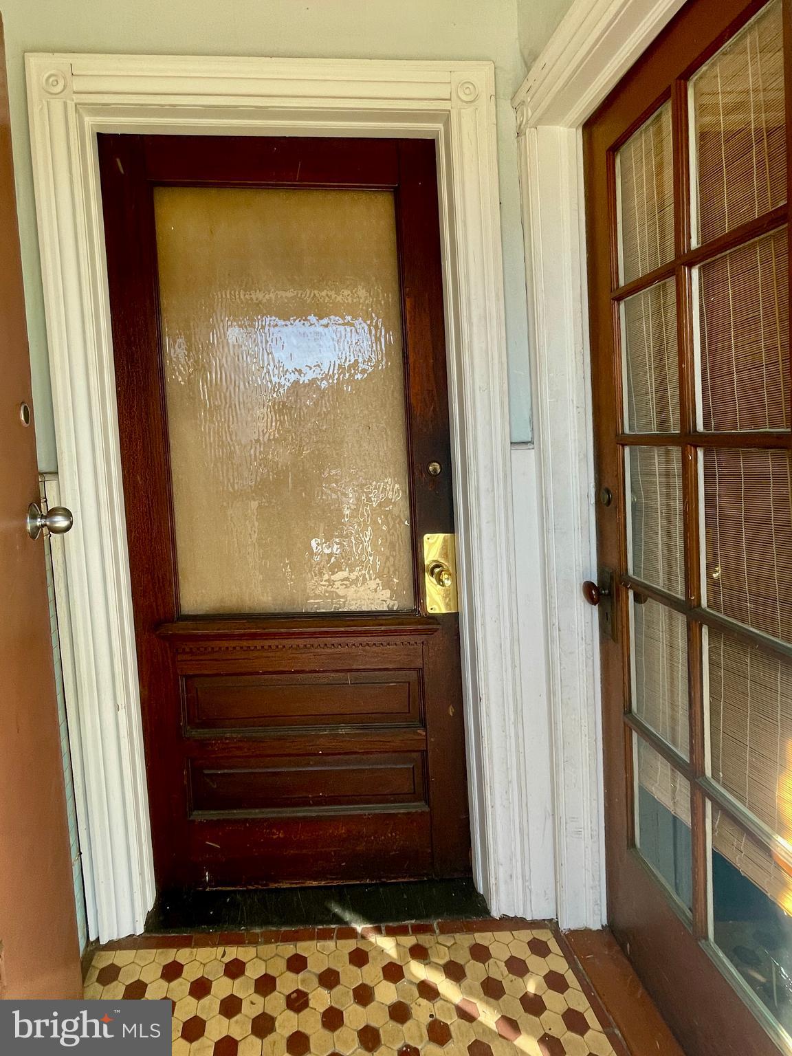 208 North 63rd Street Philadelphia, PA 19139 - Photo 7 of 29 a front view of a house with a door and a wooden floor