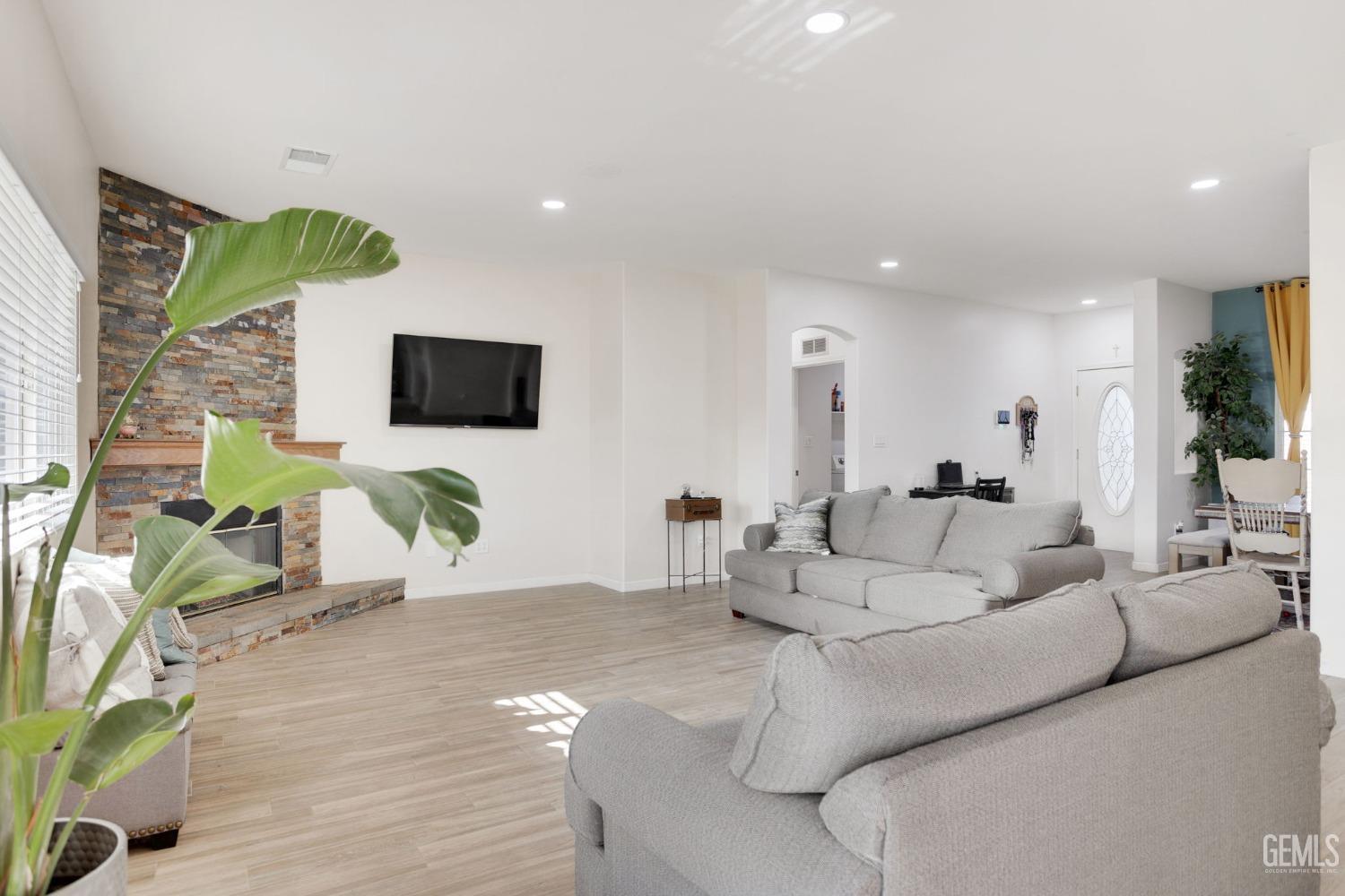 Undisclosed Address Bakersfield, CA 93312 - Photo 13 of 45 a living room with furniture and a flat screen tv
