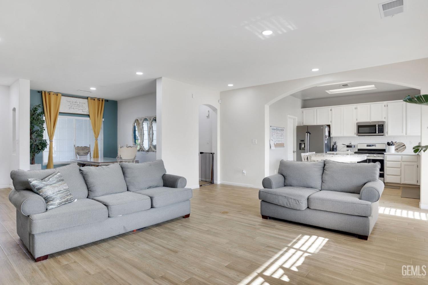 Undisclosed Address Bakersfield, CA 93312 - Photo 14 of 45 a living room with furniture and view of kitchen