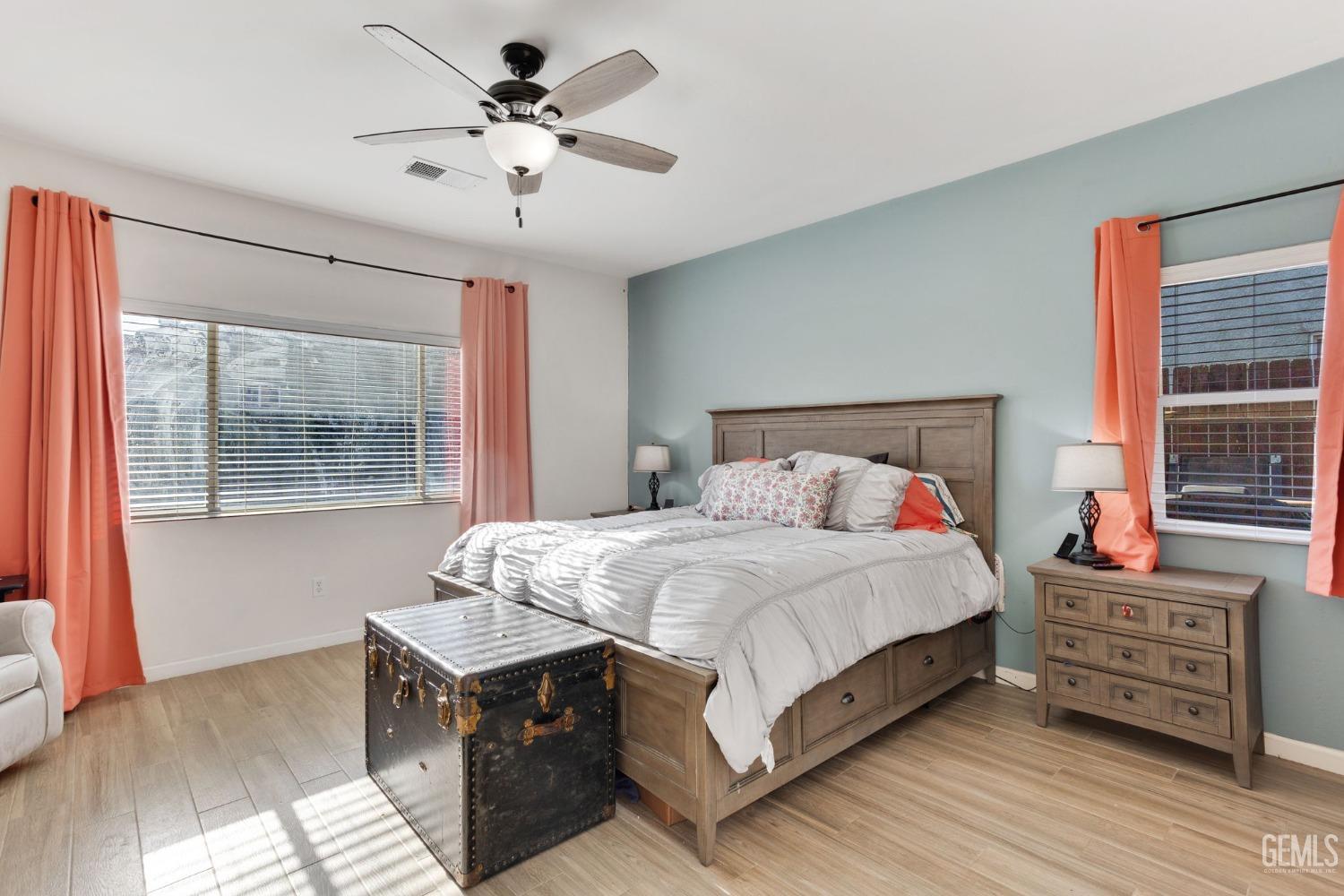 Undisclosed Address Bakersfield, CA 93312 - Photo 22 of 45 a bedroom with a bed and a chandelier