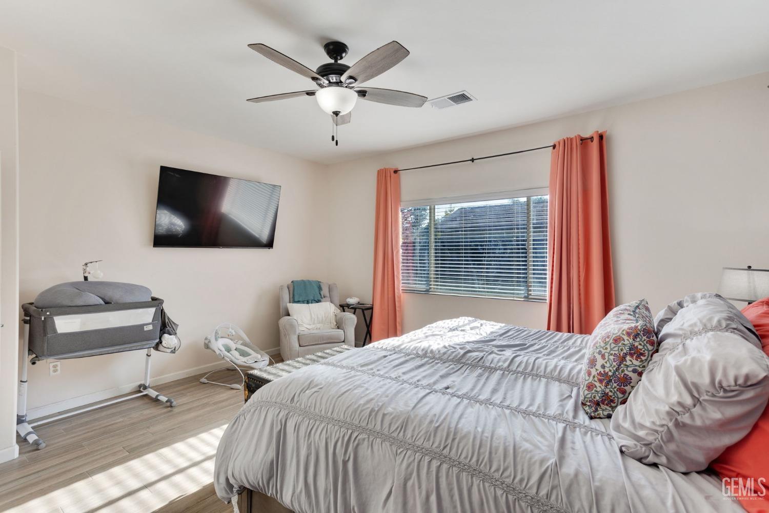 Undisclosed Address Bakersfield, CA 93312 - Photo 23 of 45 a bedroom with a bed and a flat screen tv