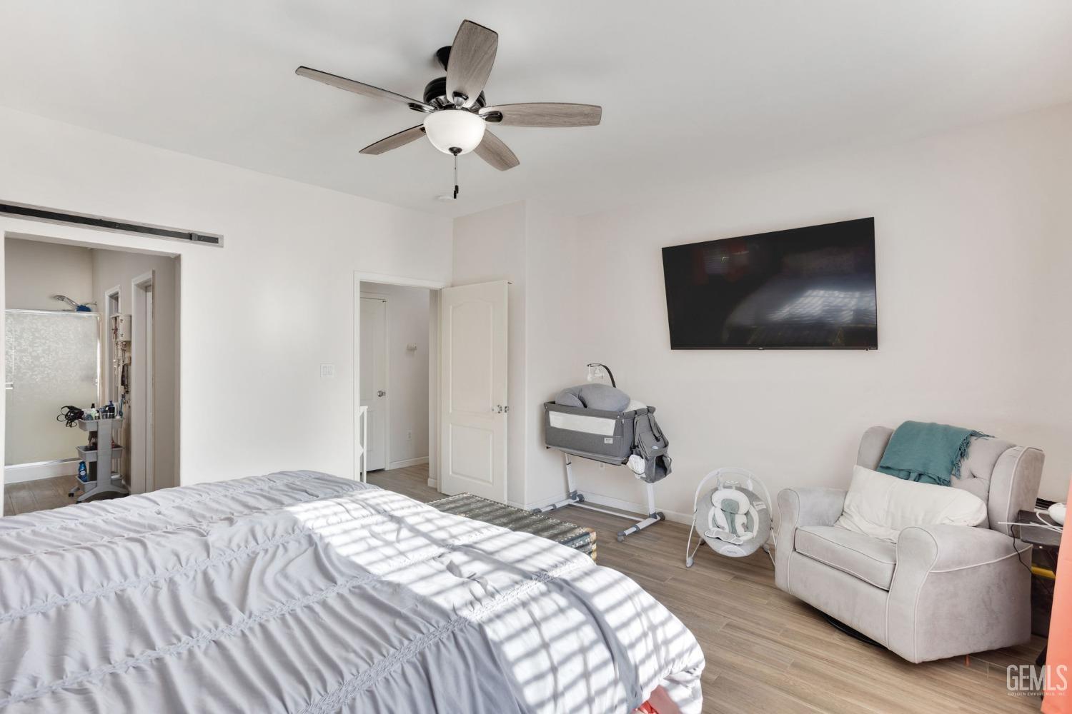 Undisclosed Address Bakersfield, CA 93312 - Photo 24 of 45 a bedroom with a bed and a flat screen tv