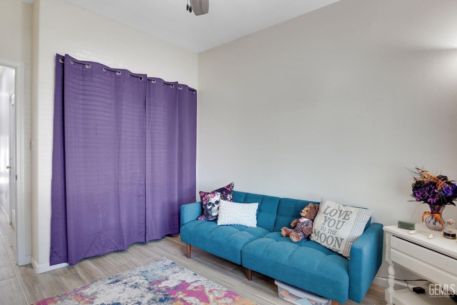 Undisclosed Address Bakersfield, CA 93312 - Photo 29 of 45 a living room with furniture and wooden floor