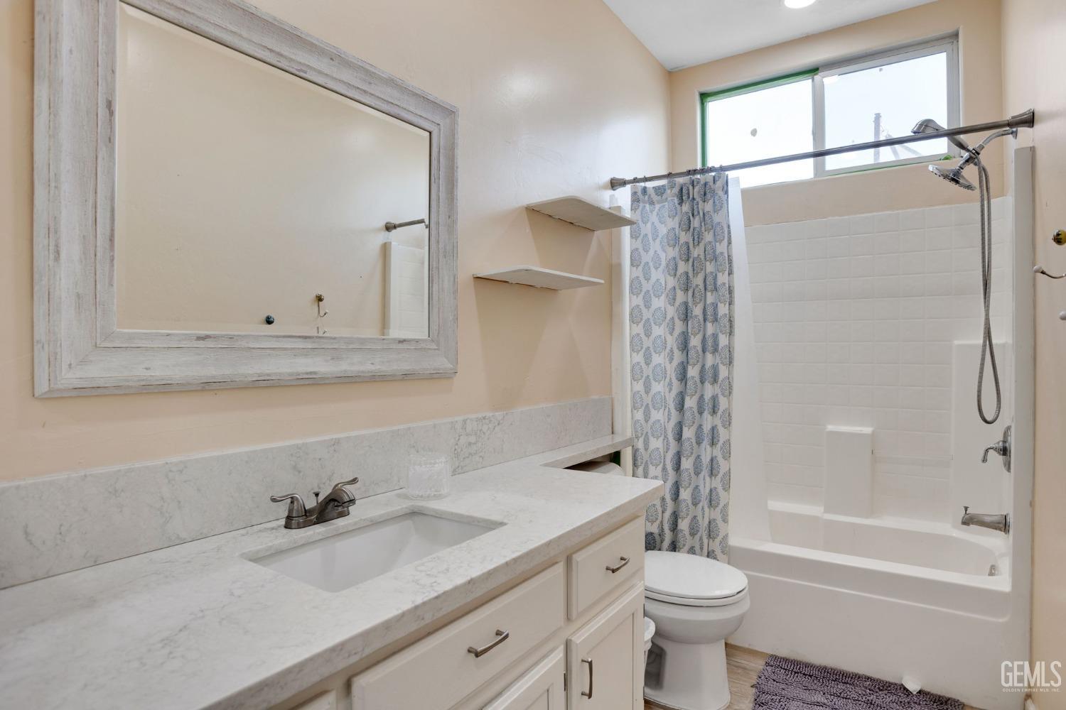 Undisclosed Address Bakersfield, CA 93312 - Photo 31 of 45 a bathroom with a sink a toilet and shower