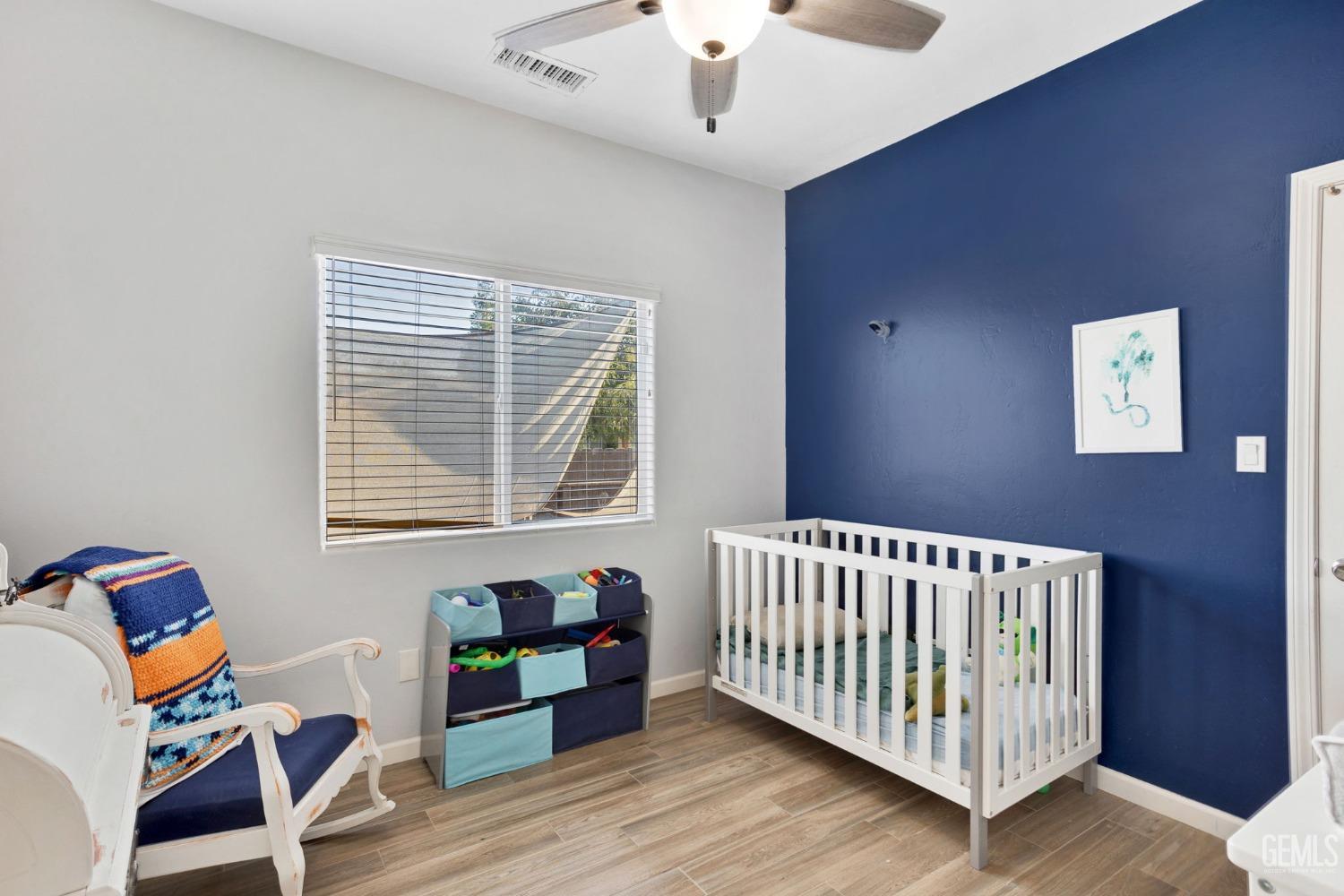 Undisclosed Address Bakersfield, CA 93312 - Photo 32 of 45 a bedroom with furniture and wooden floor