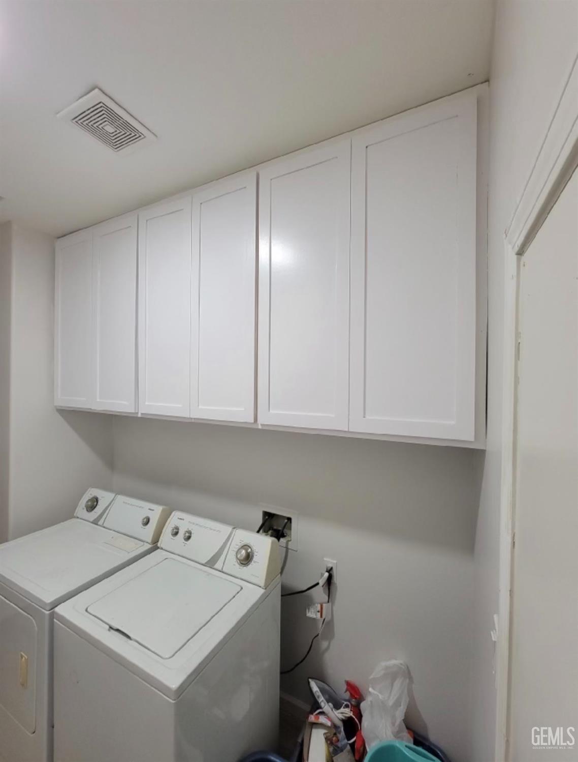 Undisclosed Address Bakersfield, CA 93312 - Photo 36 of 45 a view of storage and utility room with washer and dryer
