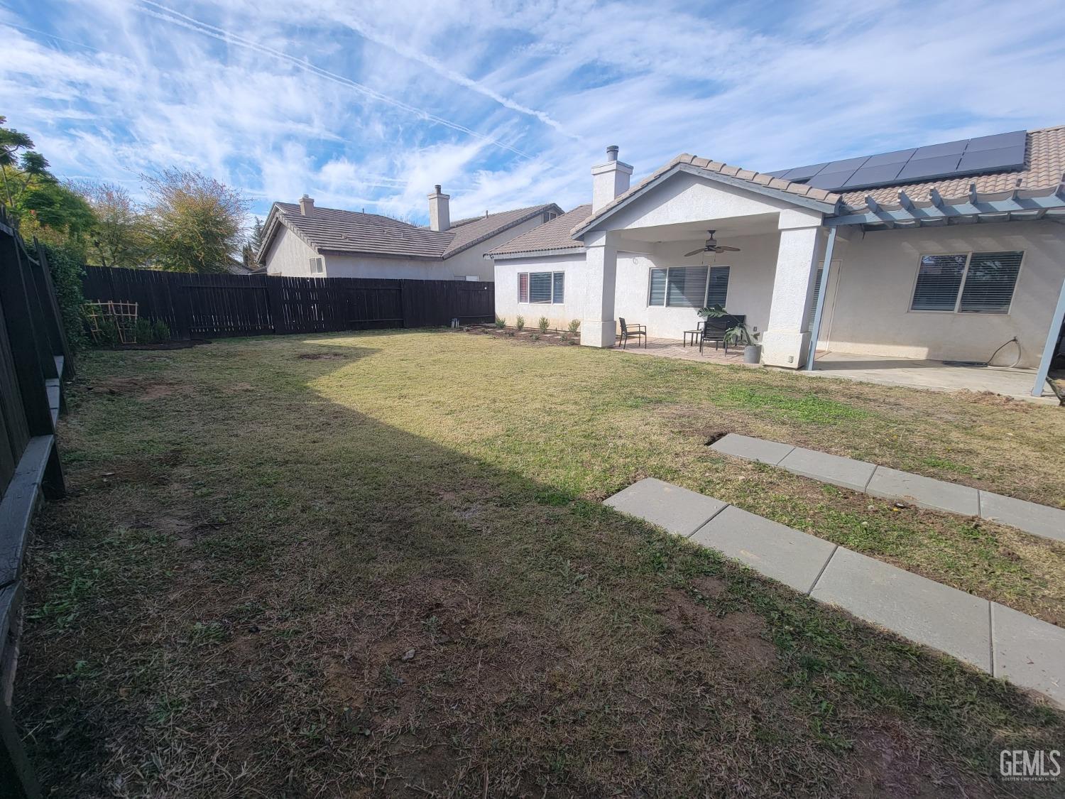Undisclosed Address Bakersfield, CA 93312 - Photo 38 of 45 a front view of a house with a yard