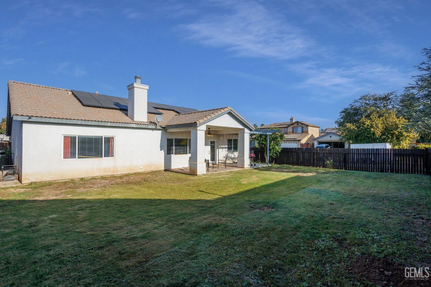 Undisclosed Address Bakersfield, CA 93312 - Photo 39 of 45 a front view of a house with a garden