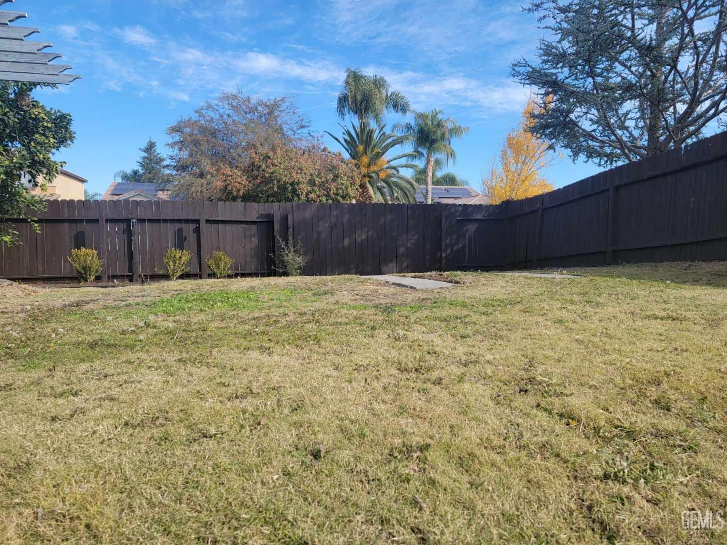 Undisclosed Address Bakersfield, CA 93312 - Photo 41 of 45 a view of a yard with a house