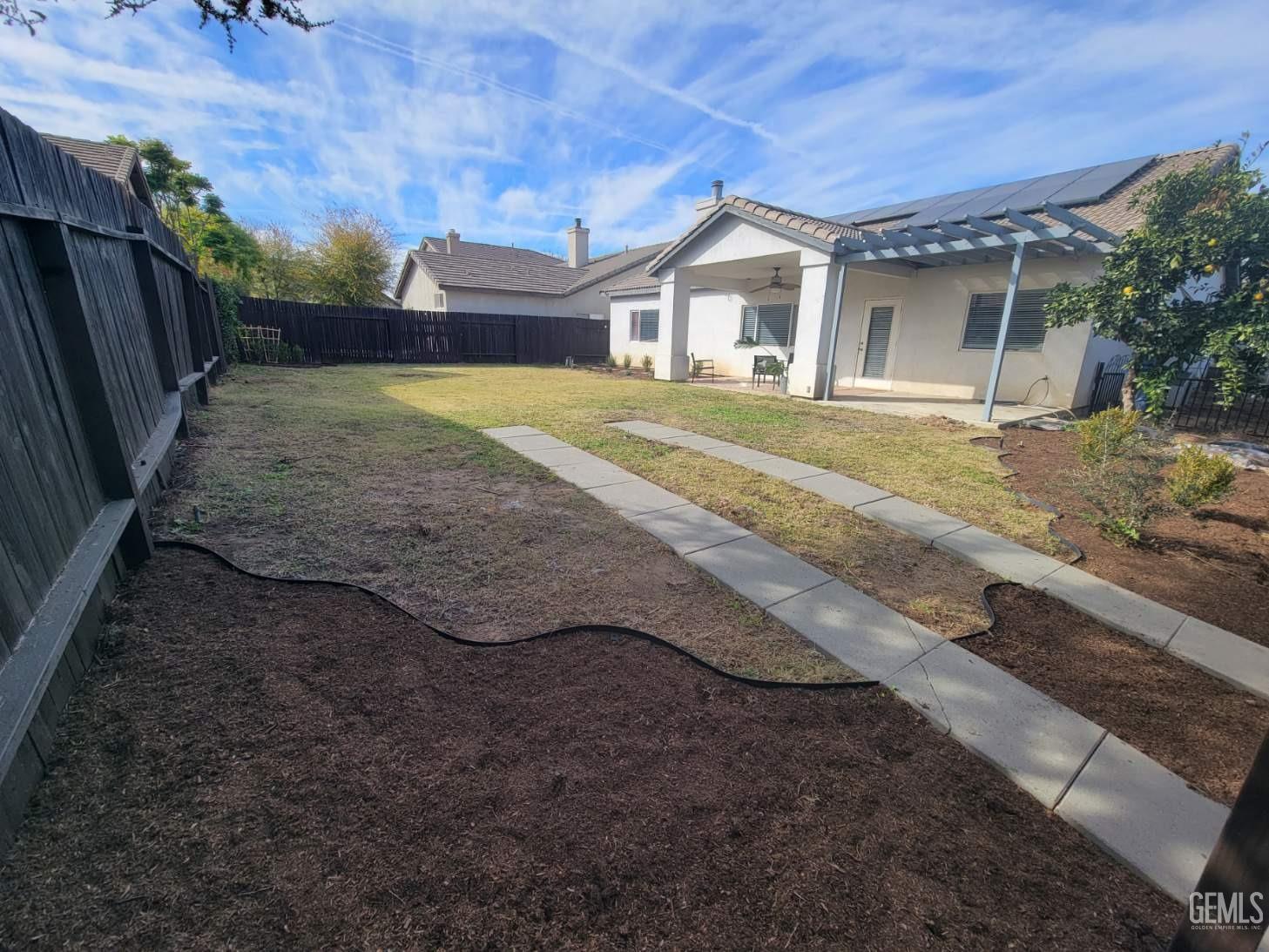 Undisclosed Address Bakersfield, CA 93312 - Photo 45 of 45 a view of a house with a yard