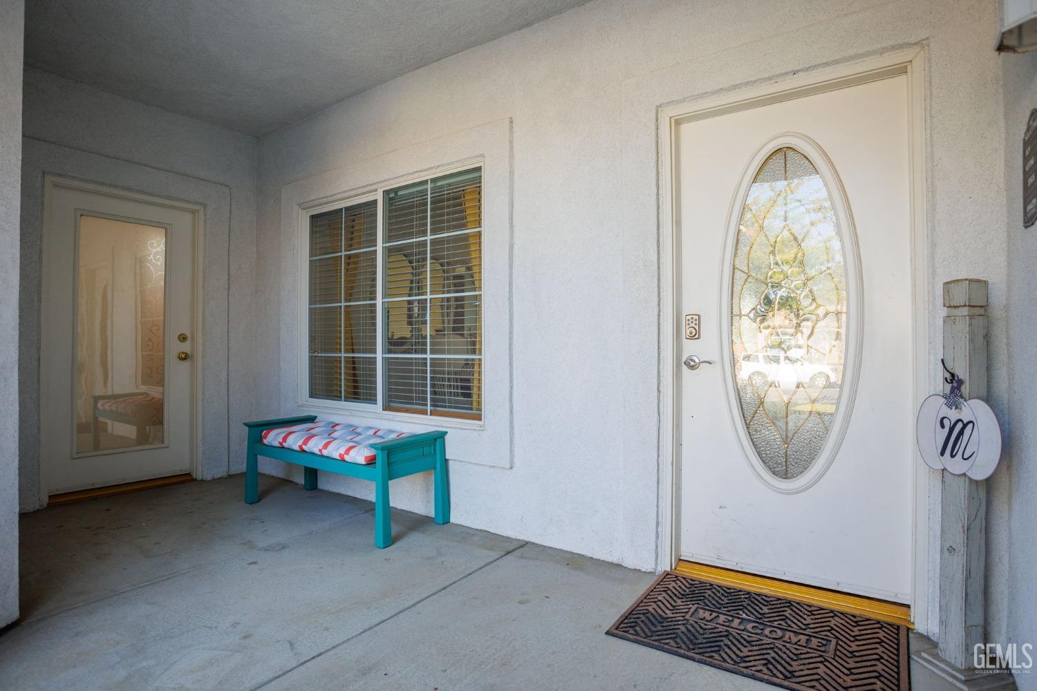 Undisclosed Address Bakersfield, CA 93312 - Photo 5 of 45 a living room with a window and a table