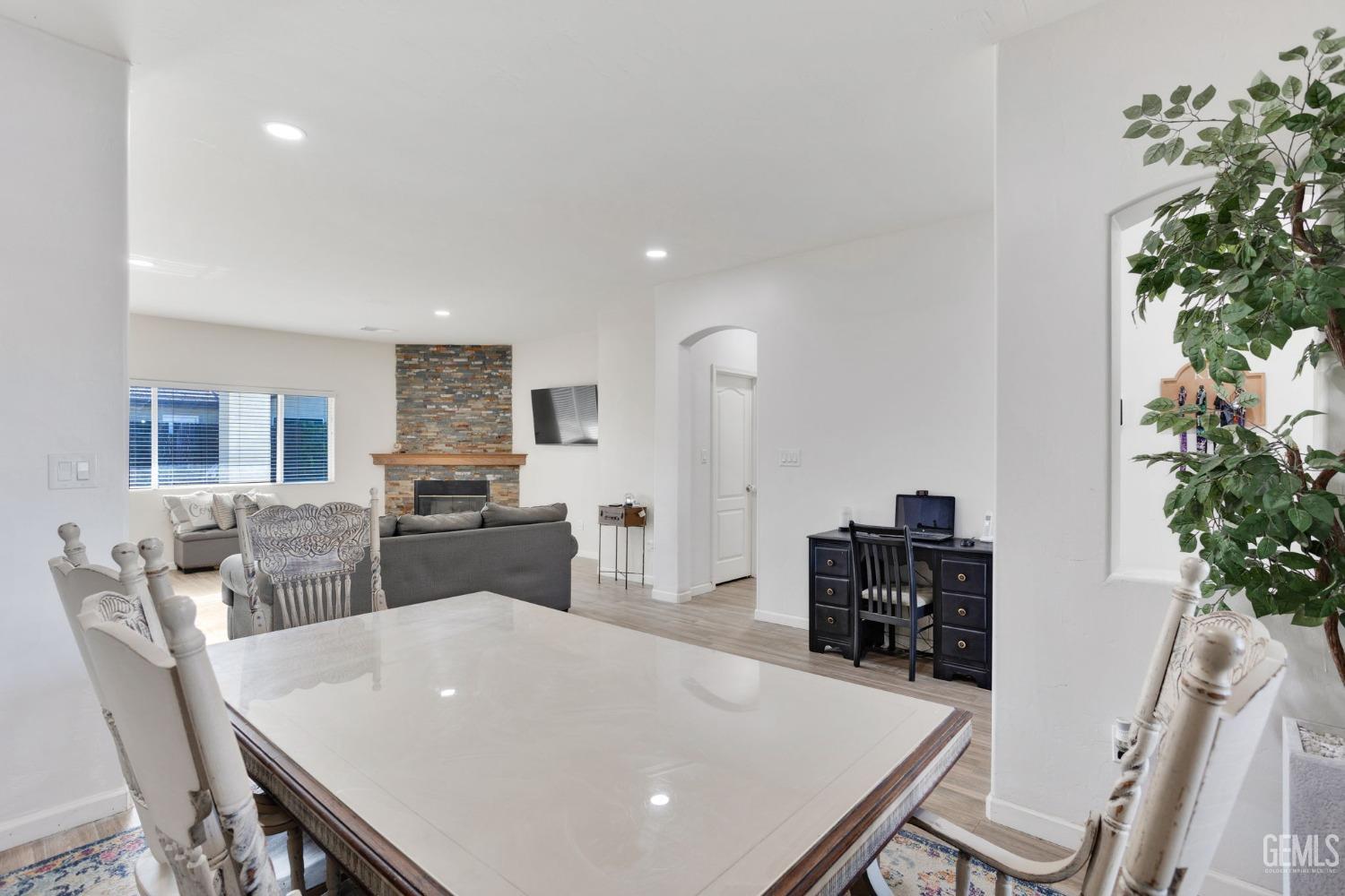 Undisclosed Address Bakersfield, CA 93312 - Photo 10 of 45 a living room with furniture potted plant and refrigerator