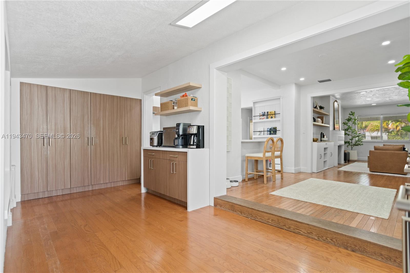 2498 Southwest 19th Terrace Miami, FL 33145 - Photo 12 of 25 a living room with furniture a flat screen tv and a table