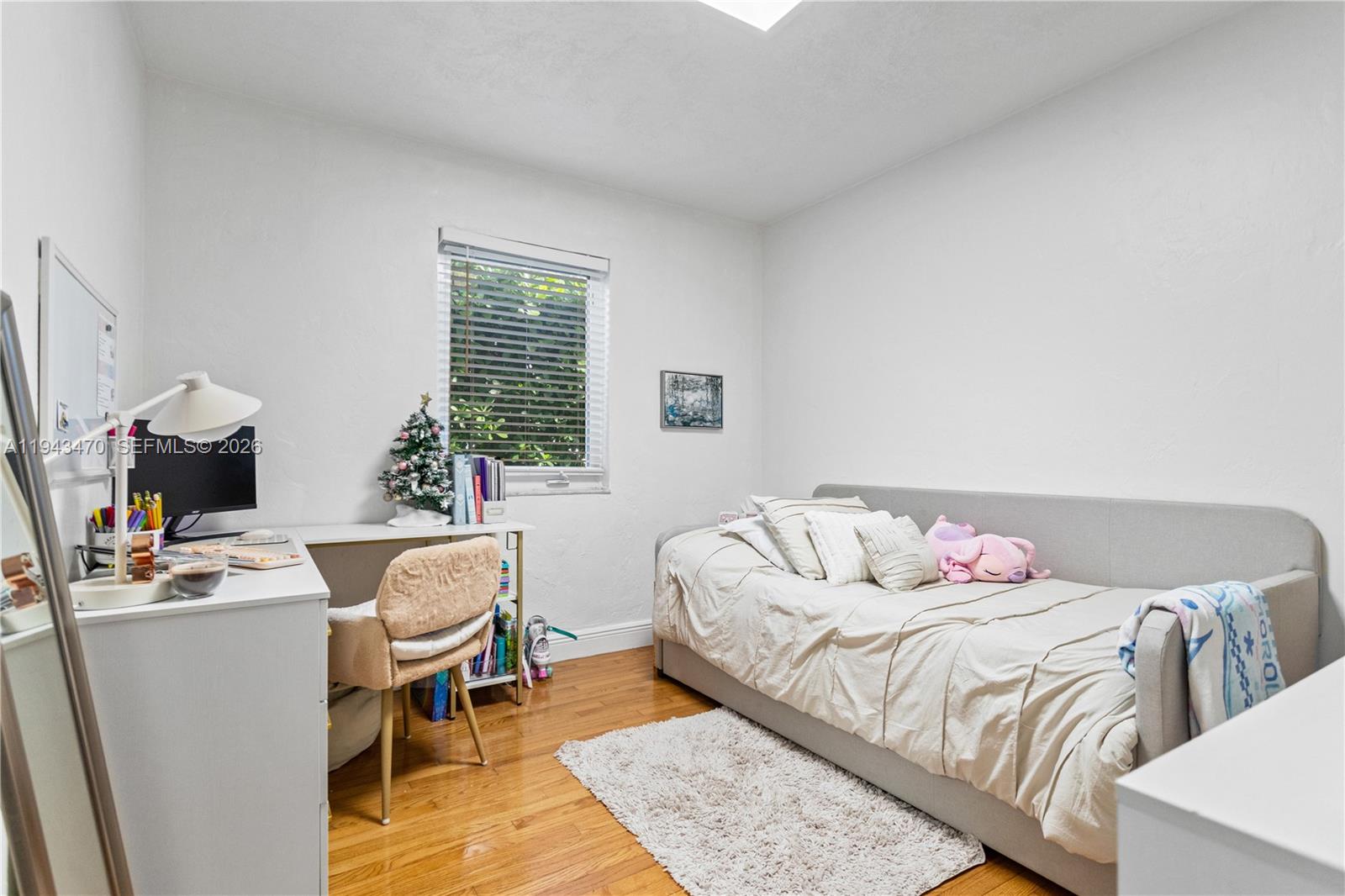 2498 Southwest 19th Terrace Miami, FL 33145 - Photo 18 of 25 a bed room with a bed and a chair