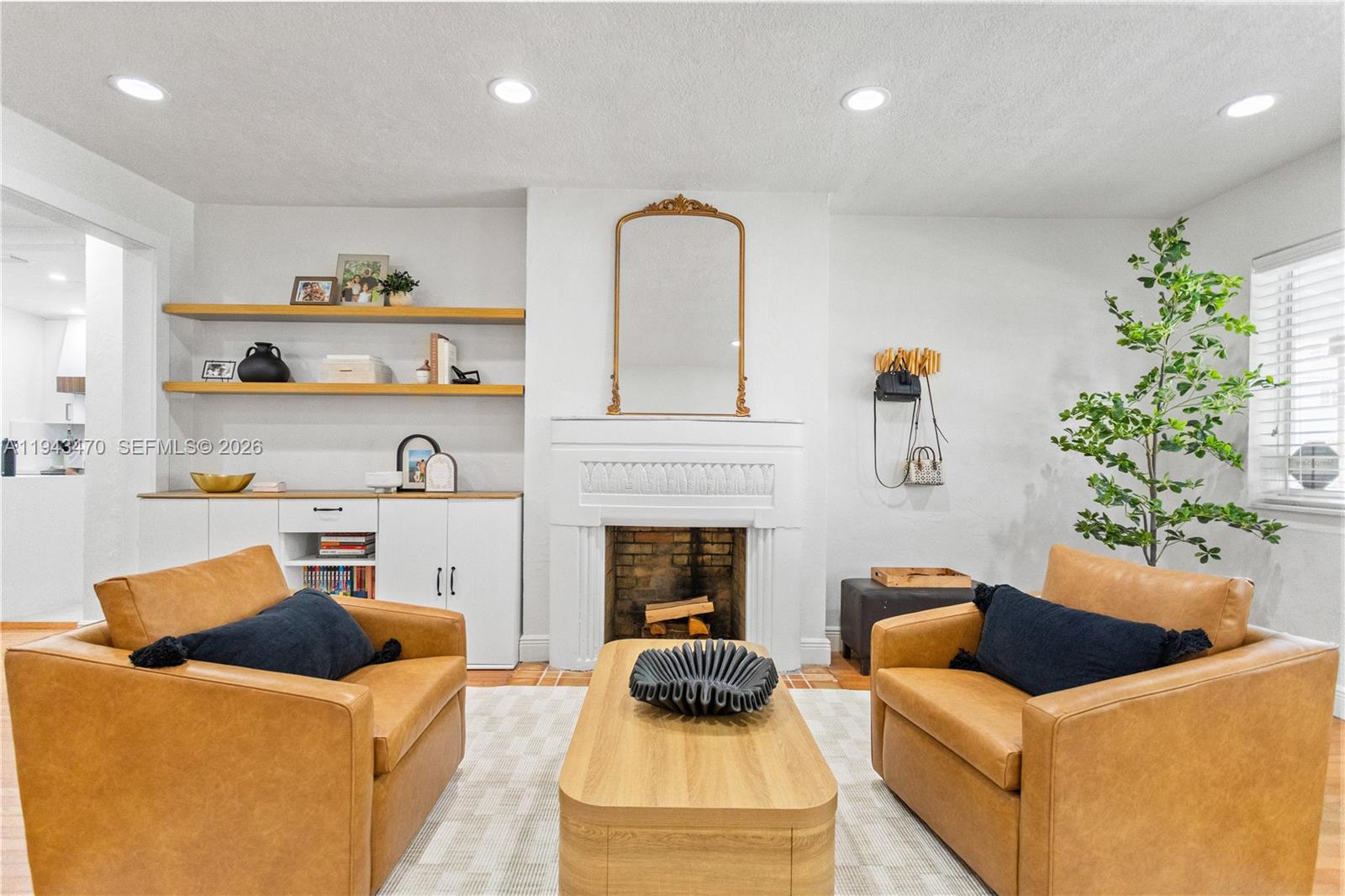 2498 Southwest 19th Terrace Miami, FL 33145 - Photo 2 of 25 a living room with furniture and a fireplace