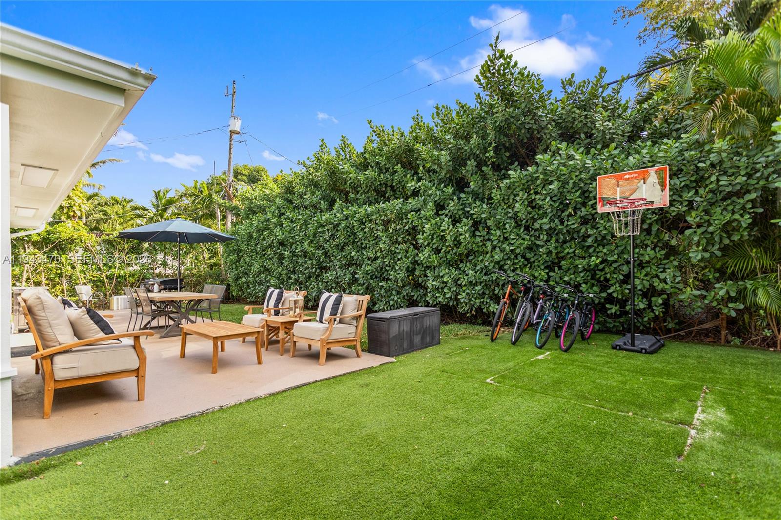 2498 Southwest 19th Terrace Miami, FL 33145 - Photo 21 of 25 a backyard of a house with table and chairs