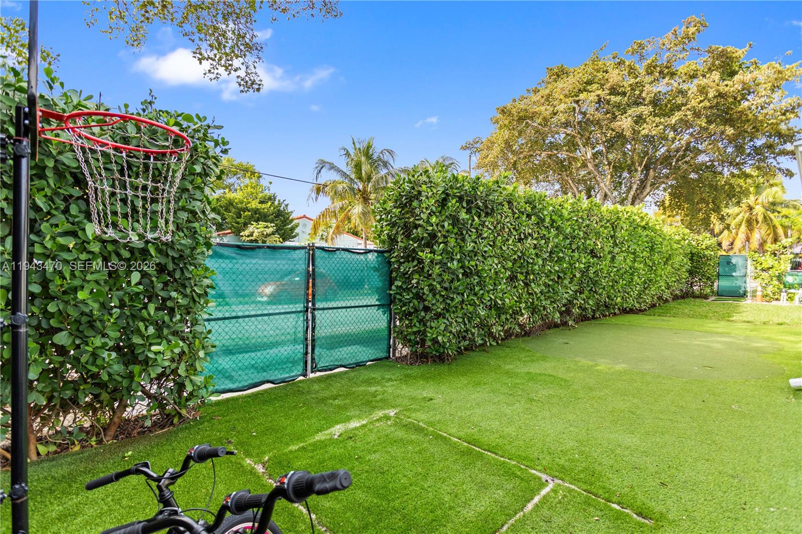 2498 Southwest 19th Terrace Miami, FL 33145 - Photo 24 of 25 a view of a garden with a bench