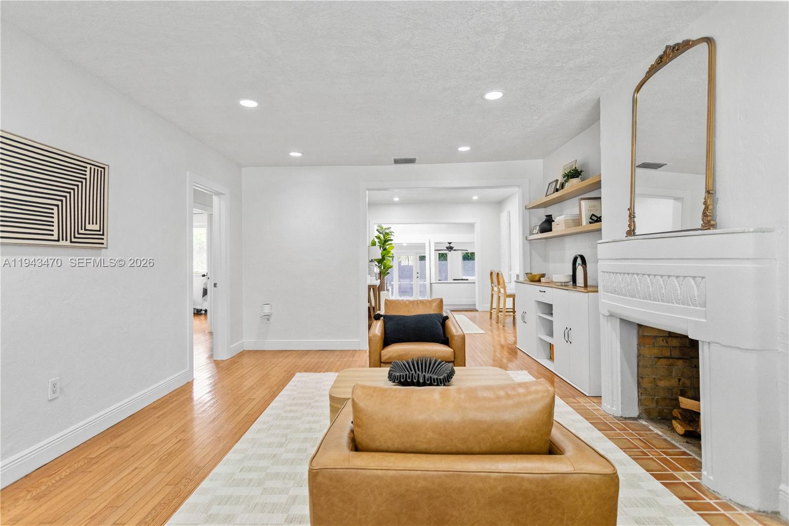 2498 Southwest 19th Terrace Miami, FL 33145 - Photo 3 of 25 a living room with furniture and a fireplace