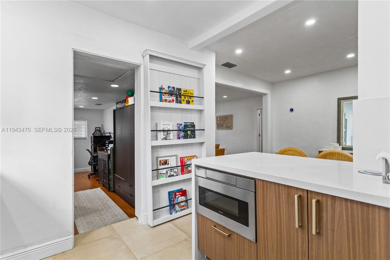 2498 Southwest 19th Terrace Miami, FL 33145 - Photo 6 of 25 a kitchen that has a lot of cabinets in it