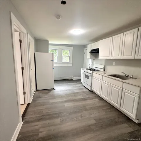 a bathroom with a bathtub and a sink