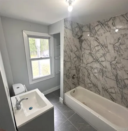 a large bathroom with a tub
