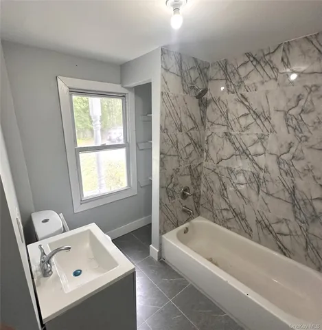 a large bathroom with a tub