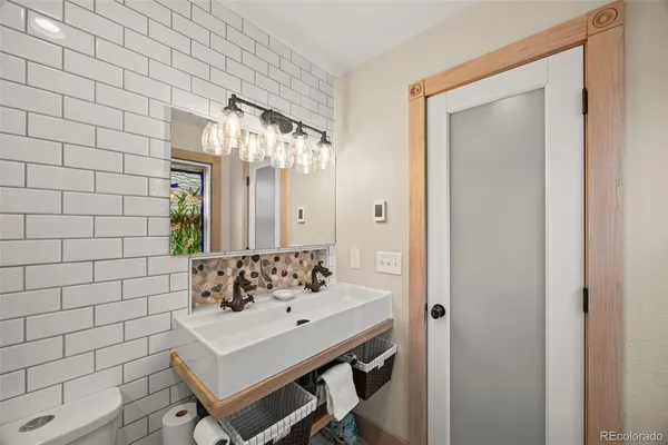 a bathroom with a sink and a mirror
