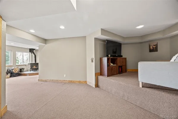 a balcony with couch and wooden floor