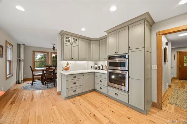 a kitchen with stainless steel appliances a stove and a refrigerator