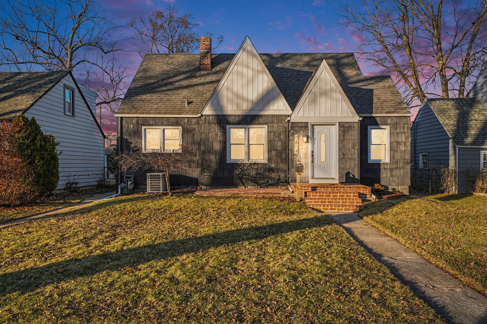 a front view of house with yard outdoor seating and barbeque oven