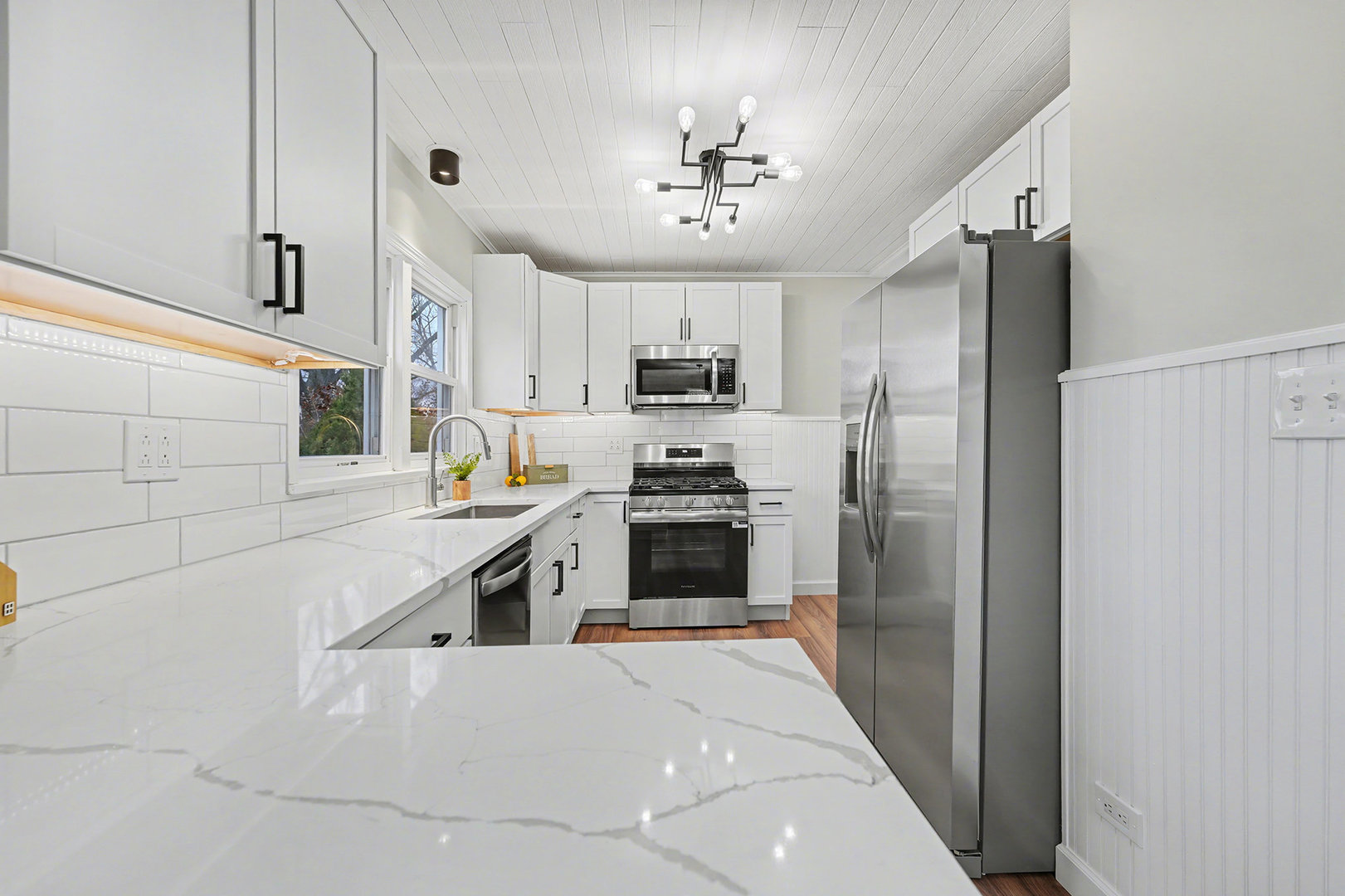 3634 178th Street Lansing, IL 60438 - Photo 11 of 28 a large kitchen with cabinets and stainless steel appliances