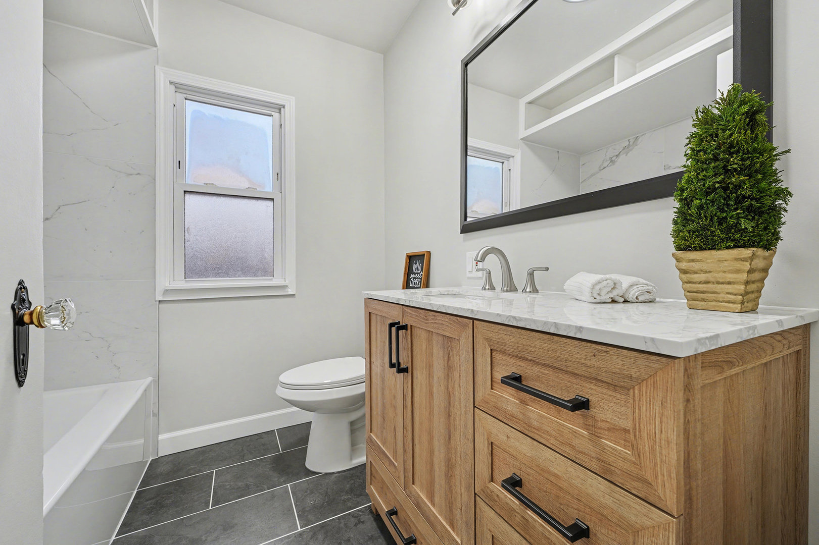 3634 178th Street Lansing, IL 60438 - Photo 12 of 28 a bathroom with a sink toilet and vanity