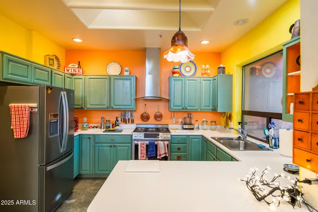 a view of a kitchen with a window and cabinets