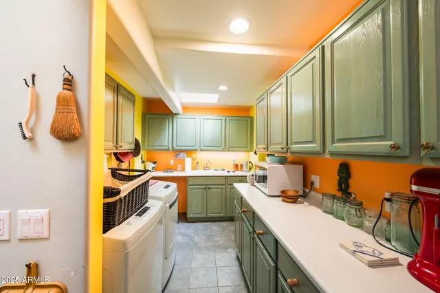 a kitchen with a sink and cabinets