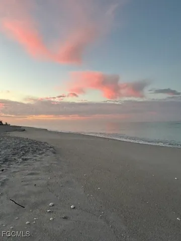 a bedroom with a bed and dresser