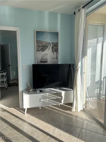 a room with furniture and flat screen tv