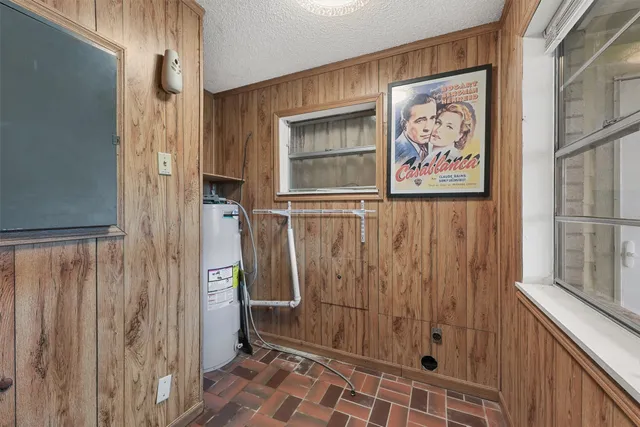 a bathroom with a shower and a sink
