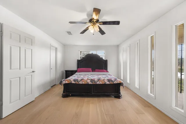 a bedroom with a bed and window