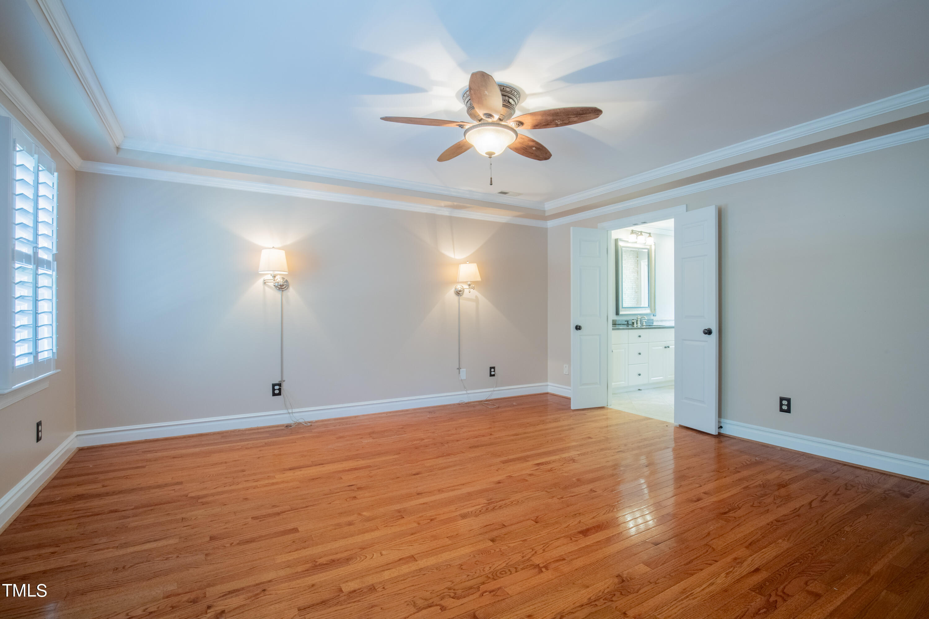 3308 Tall Tree Place Raleigh, NC 27607 - Photo 16 of 34 a view of an empty room with wooden floor and a window