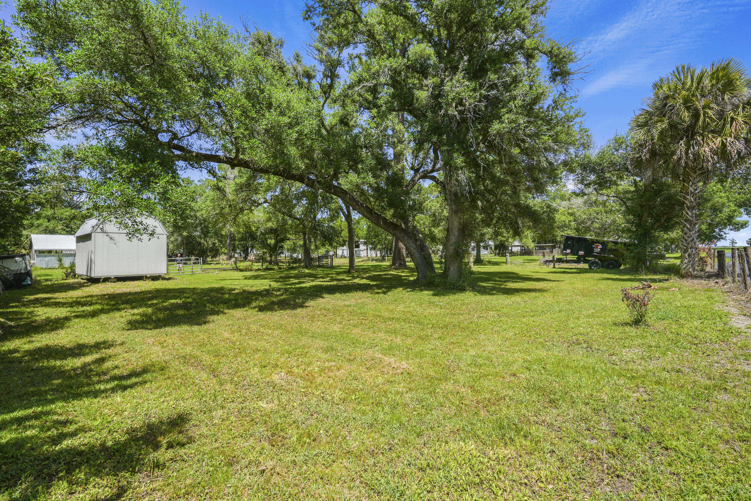 6289 South Header Canal Road Port St. Lucie, FL 34987 - Photo 24 of 52 a view of a park with large trees