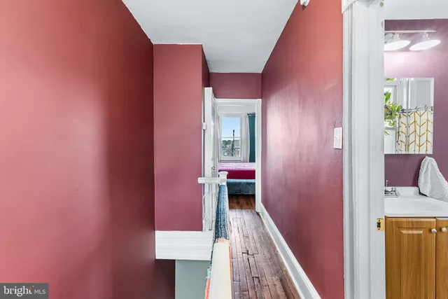a bathroom with a sink a toilet and shower curtain