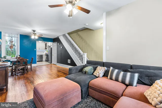 a kitchen with a refrigerator and a sink