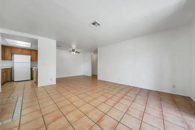 a kitchen with a sink and a refrigerator