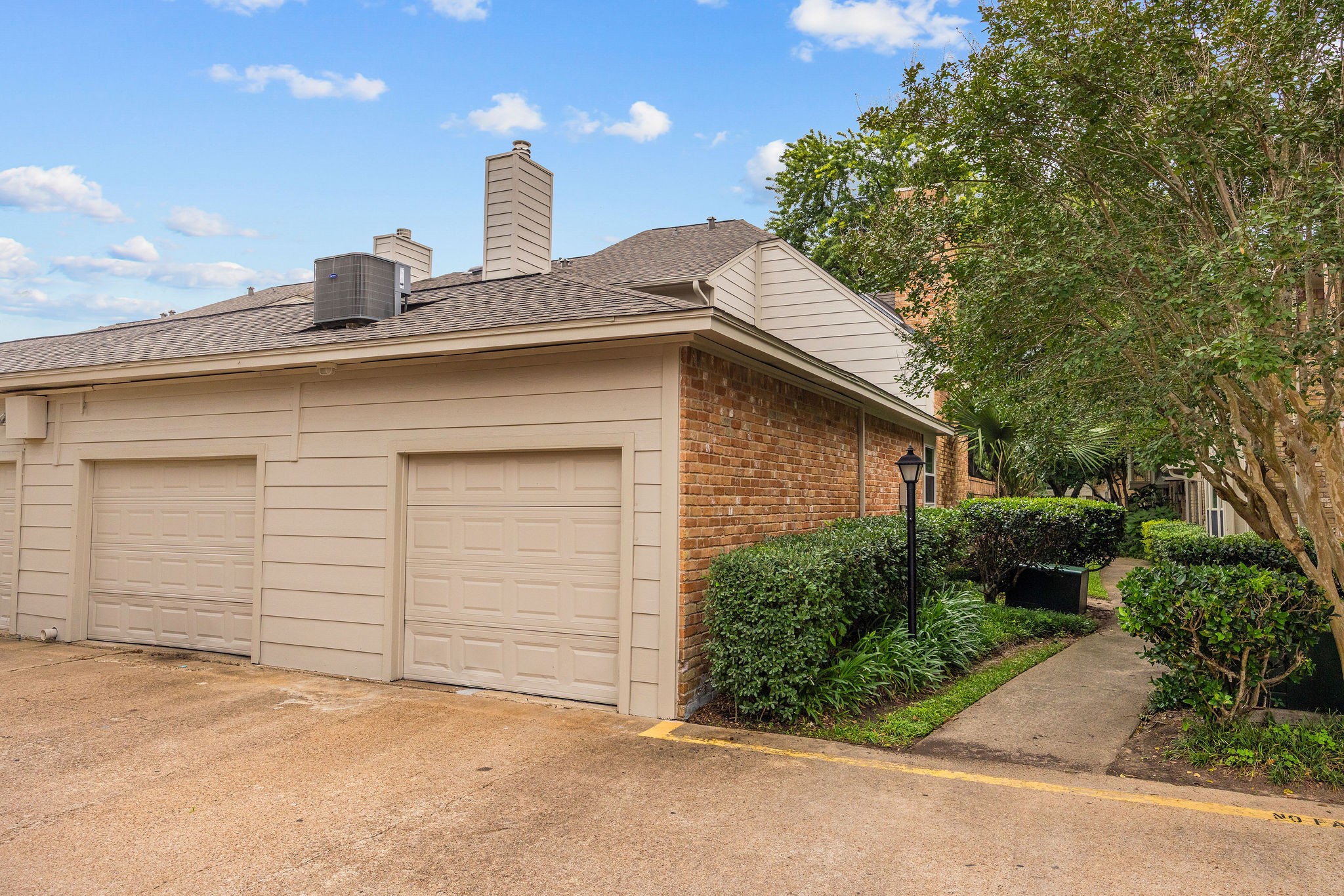 727 Bunker Hill Road, Unit 26 Houston, TX 77024 - Photo 23 of 25 View of the 2-car garage, so getting in and out of the community is a breeze.